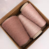Soft mohair yarn from Kidmohair by Yarns from Italy, featuring a blend of viscose and elastane in a cozy, textured bundle.