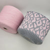 Soft cream-colored alpaca yarn from CRAFT MIND, showcasing thick, fluffy fibers ideal for cozy knitting projects.