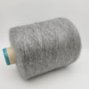 Cream-colored Super Kid Mohair & Silk yarn by CRAFT MIND, showing soft, fluffy fibers in 25g skein.