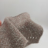 Close-up of SIA Craft Mind Yarns Italy fine boucle Merino yarn showing soft, textured fibers in natural cream color.