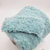Cream-colored Boucle yarn made of soft mohair by SIA Craft Mind Yarns from Italy, displayed in a close-up shot.