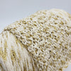 Close-up of Yarns from Italy 100% cotton fabric with lurex shimmer, showing the soft texture and metallic thread details.
