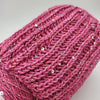 Yarns from Italy cotton fabric with shiny paillettes, soft textured material for stylish sewing or craft projects.